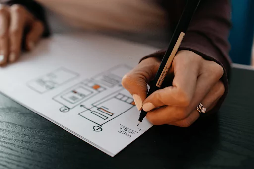 Woman drawing on paper